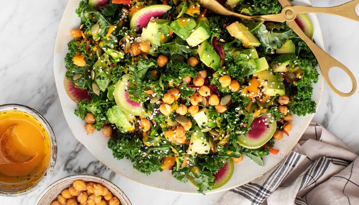 The greens and oranges of this vibrant, picture-perfect salad highlight its health benefits | HealthDiscovery.org