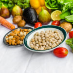 fresh fruit, vegetables and peanuts for prostate health on a white background | Corporate Synergies