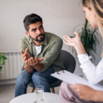 Bearded Man Discussing EAPs and Mental Health with His Counselor | Corporate Synergies