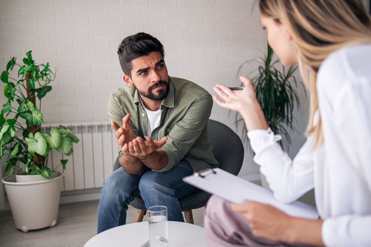 Bearded Man Discussing EAPs and Mental Health with His Counselor | Corporate Synergies