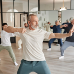 Senior man in tai chi class as an alternative therapy for stress | Corporate Synergies