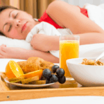 nutritious breakfast and girl in bed with eyes closed for sleep health | Corporate Synergies