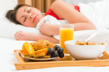 nutritious breakfast and girl in bed with eyes closed for sleep health | Corporate Synergies