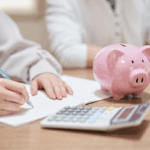 Couple reviewing household budget for tax-saving health accounts | HealthDiscovery.org by BenefitsVIP | Corporate Synergies