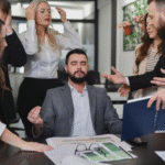 Frustrated employees with high-stress jobs behind manager who is meditating for mental resilience | Corporate Synergies