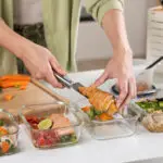 Woman preparing superfood salmon for busy workers | Corporate Synergies