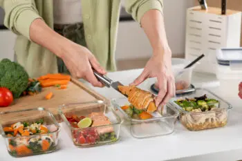 Woman preparing superfood salmon for busy workers | Corporate Synergies